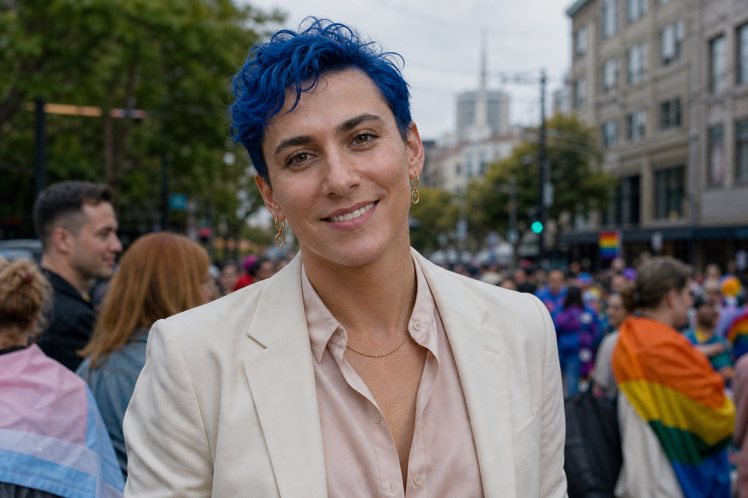 Benjamin Bavly, smiling in a cream blazer at a street gathering in San Francisco